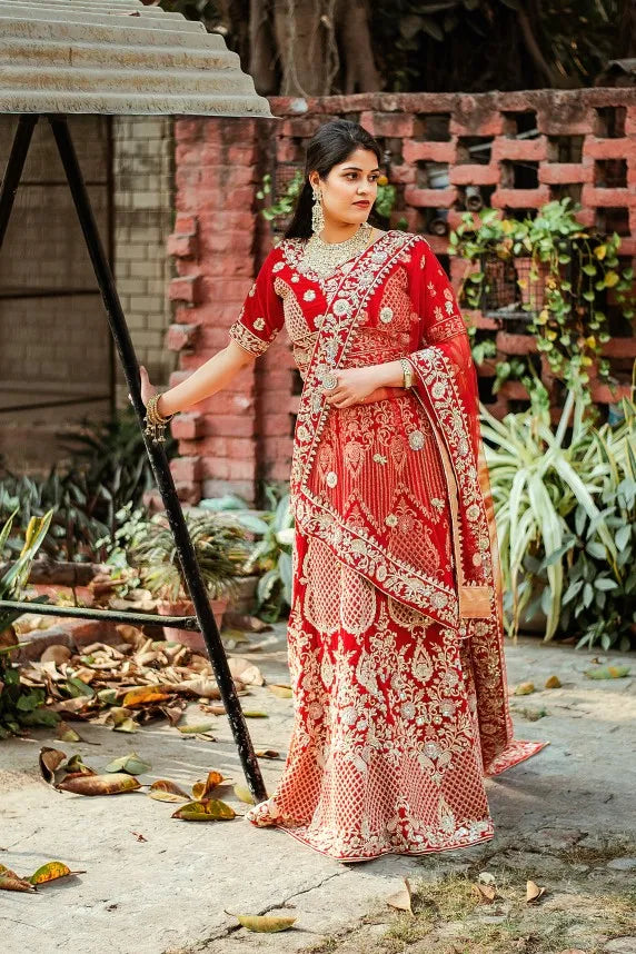 Red velvet zardozi embroidered lehenga and blouse with net dupatta