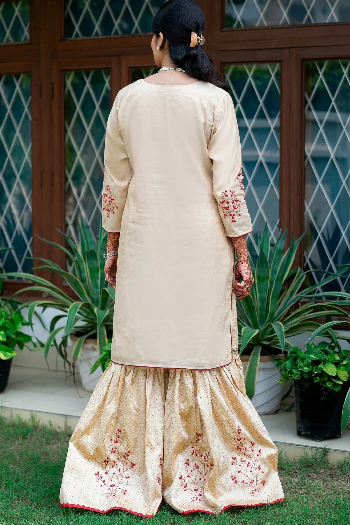 This gold Gharara with stunning applique work is a must-have for any special occasion.