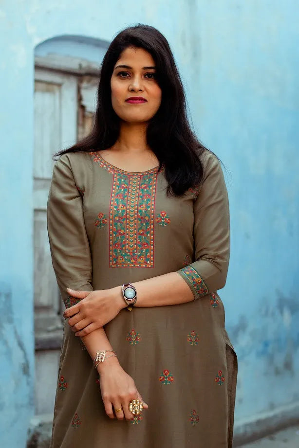 A model showcasing a Cotton Kani Suit featuring a silk-woven taupe kurta.