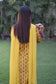 Indian women wearing yellow kurta