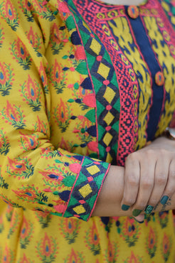 Indian women wearing  yellow colour kurta