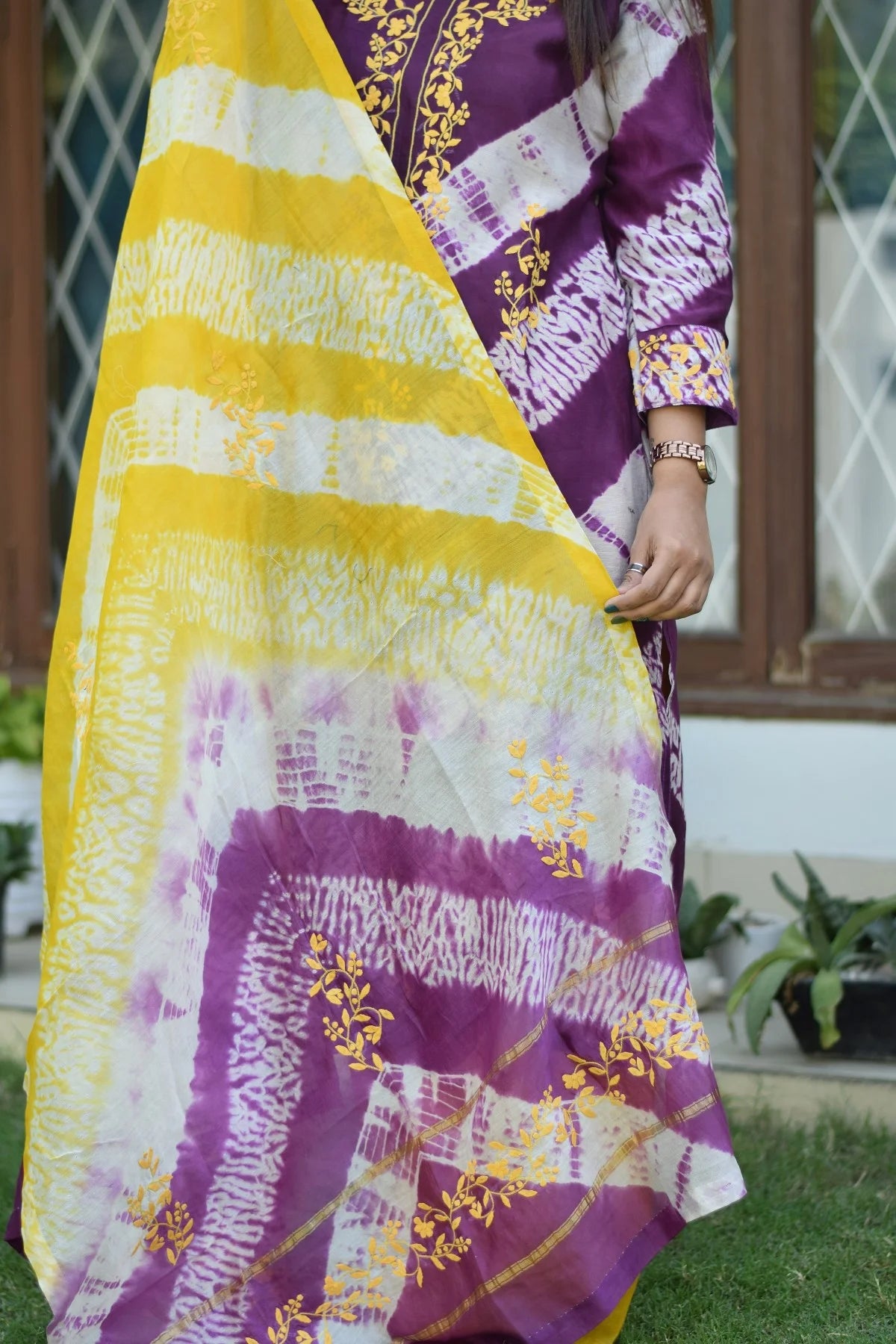 Indian women wearing applique work kurta set