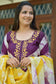 Indian women wearing purple and yellow applique work kurta