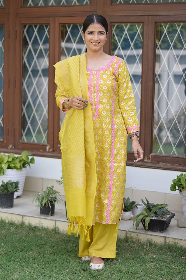 A female model posing in a stunning yellow Banarasi cotton silk kurta.