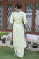 A traditional green outfit with a silk jamawar dupatta, chanderi resham embroidered kurta, and palazzo.