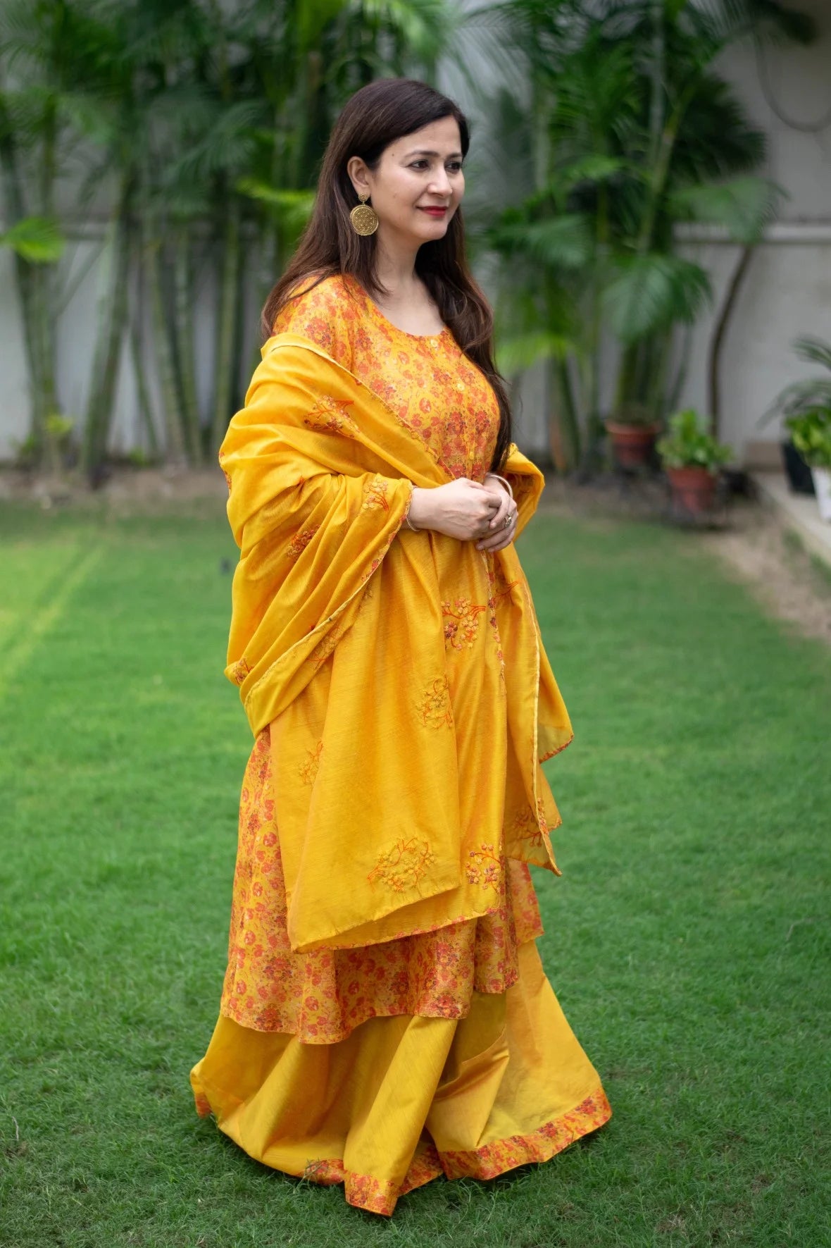 Stunning Chanderi Kurta in bright yellow complements the woman's grace.