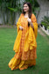 A woman looks elegant in a mustard yellow Chanderi Kurta.