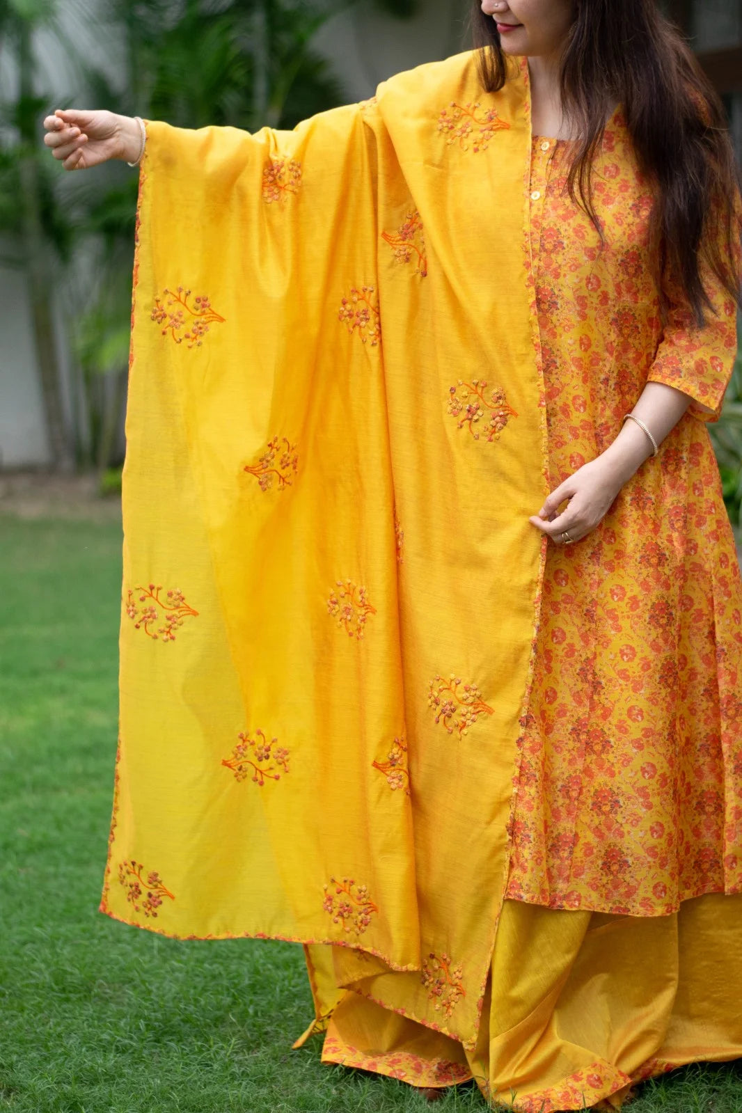 Traditional yet chic: Woman poses in a yellow Chanderi Kurta.