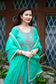 A beautiful sea green zari kurta adorned with golden threadwork.