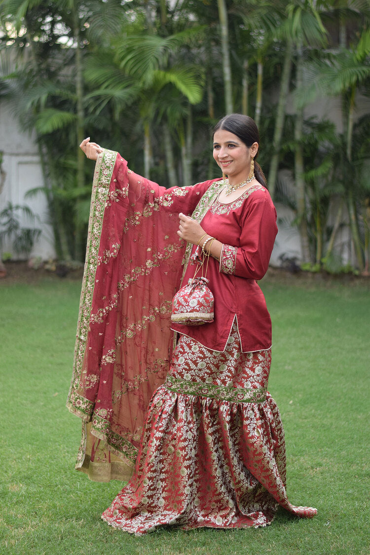 Woman wearing elegant Maroon Silk & Kamkhab Tilla Embroidered Gharara set