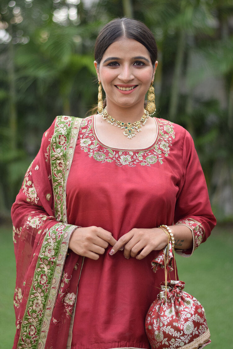 Stylish woman wearing Maroon Silk & Kamkhab Tilla Embroidered Gharara set
