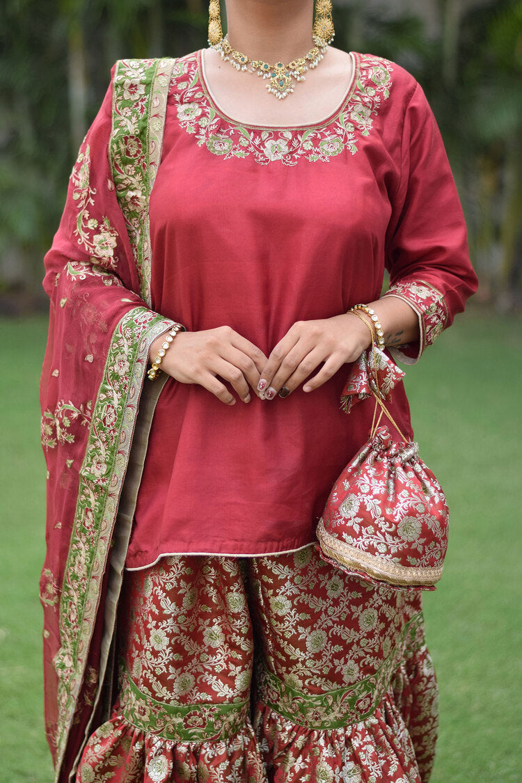 Beautifully embroidered Maroon Silk & Kamkhab Tilla Gharara set on a lady