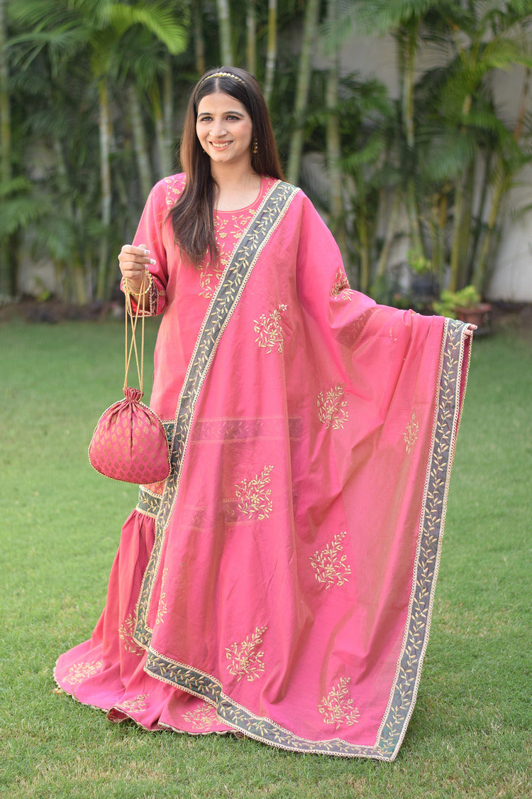 Stunning pink Chanderi Gharara set featuring beautiful Aari and tissue applique work on a graceful woman.