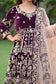 A traditional bridal outfit in rich wine velvet with Zardozi embroidery, perfect for a wedding celebration.