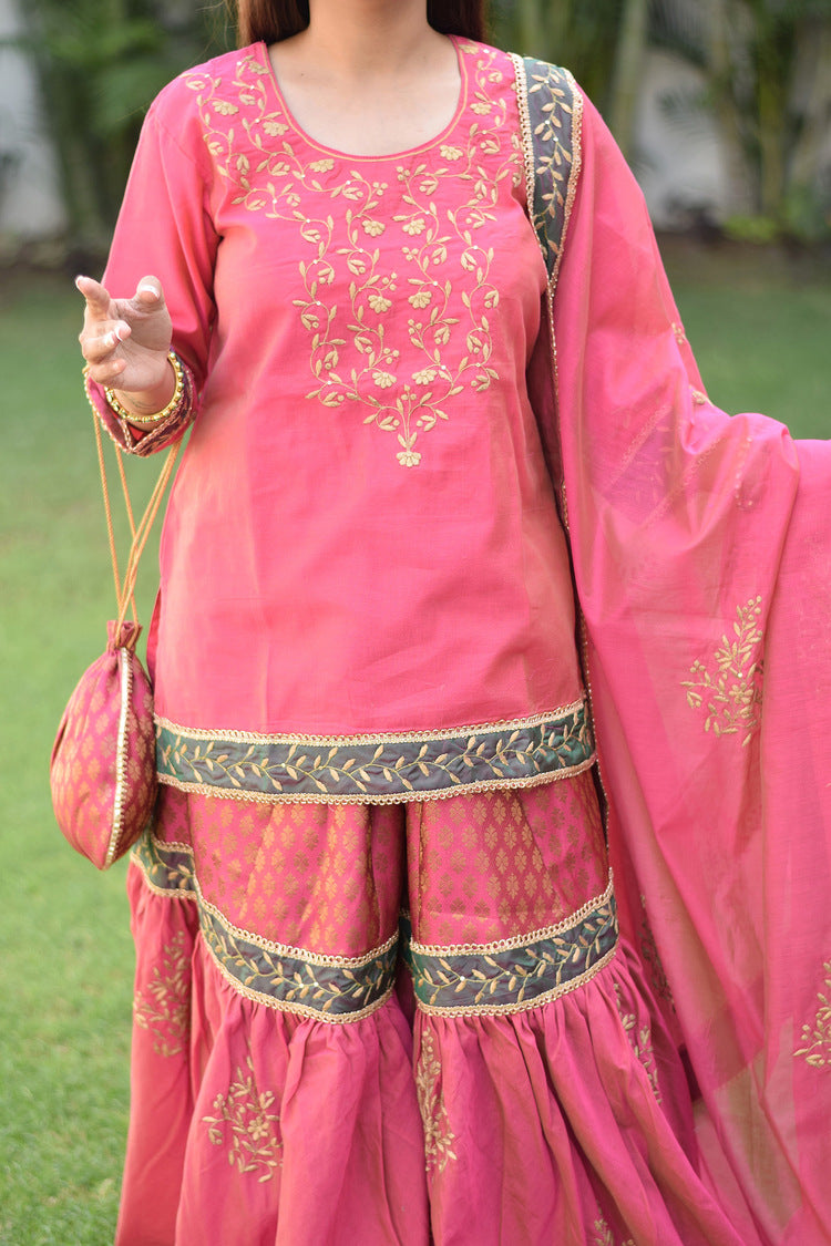 Fuchsia pink Chanderi Gharara set beautifully decorated with intricate Aari and tissue applique work on a graceful lady.