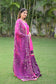 A lady in a colorful Purple and Magenta Silk Applique Gharara set.