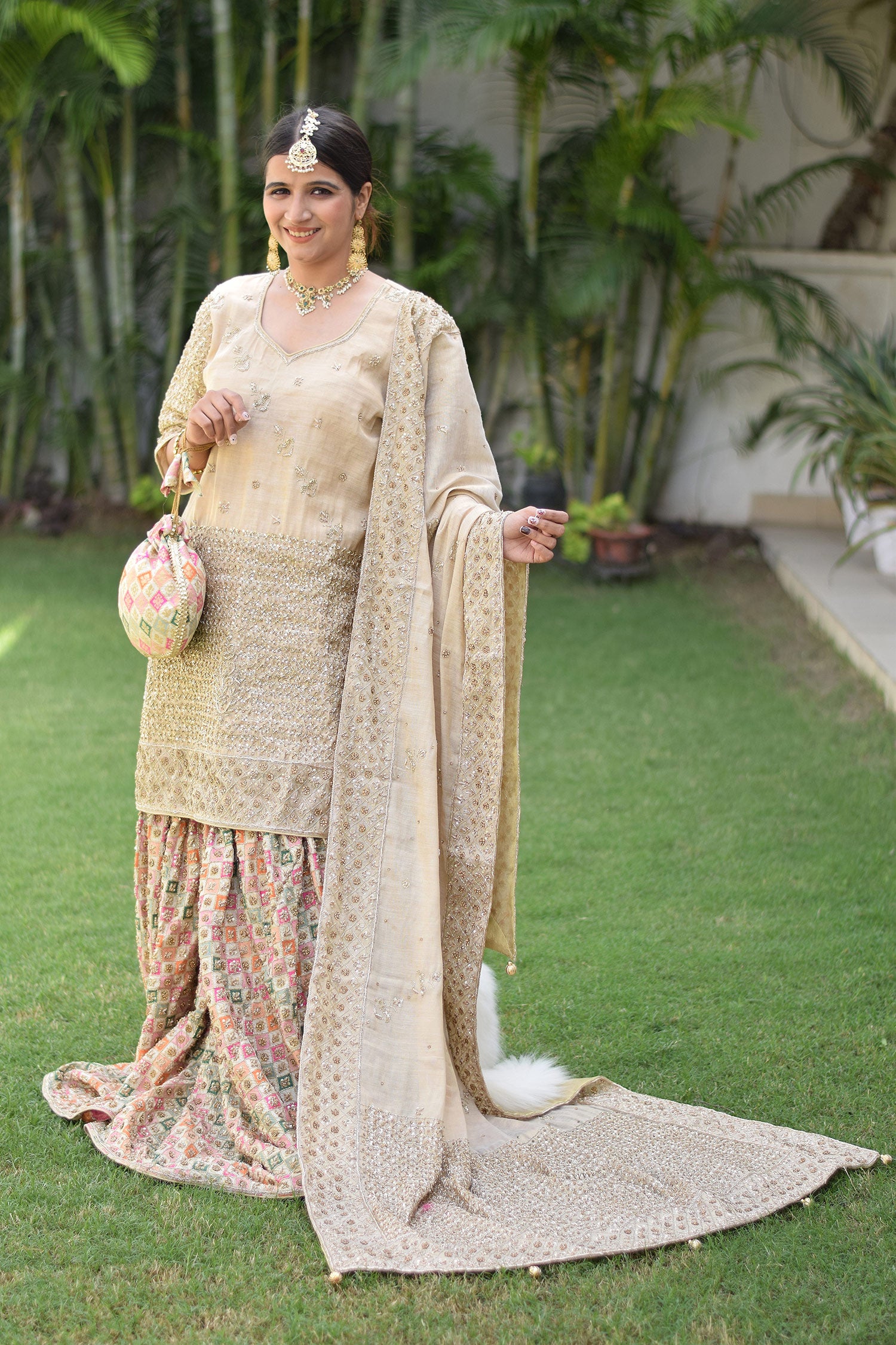 Indian womne wearing brocade Gharara with zardozi work
