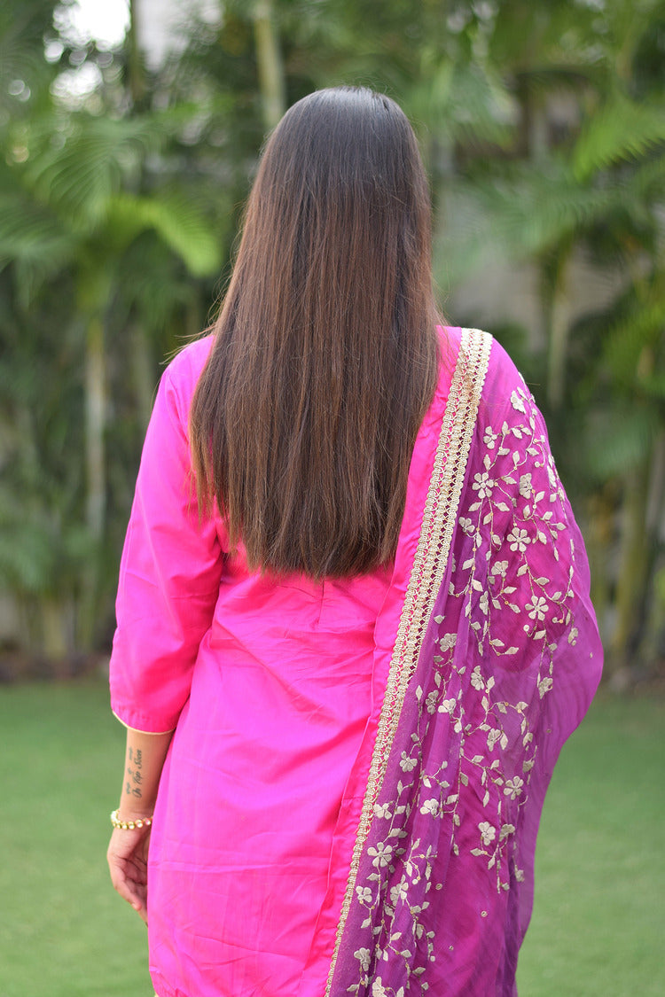 A stylish lady flaunting a Purple and Magenta Silk Applique Gharara set.