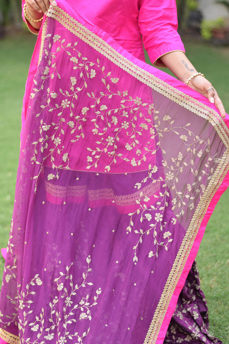 A sophisticated lady in a mesmerizing Purple and Magenta Silk Applique Gharara set.