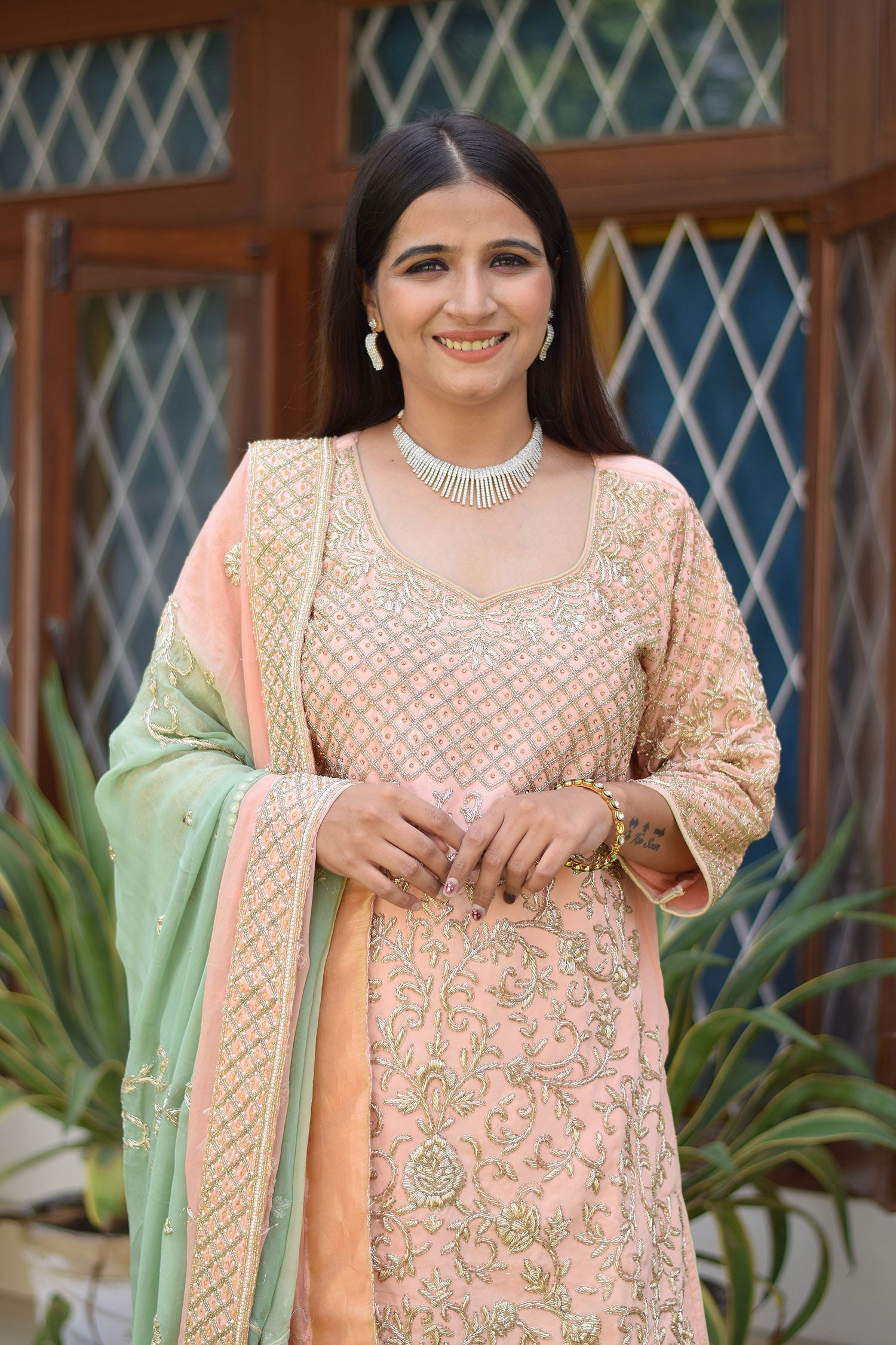 Elegant attire with Peach Crepe Silk Zardozi Jaal Work Gharara Set