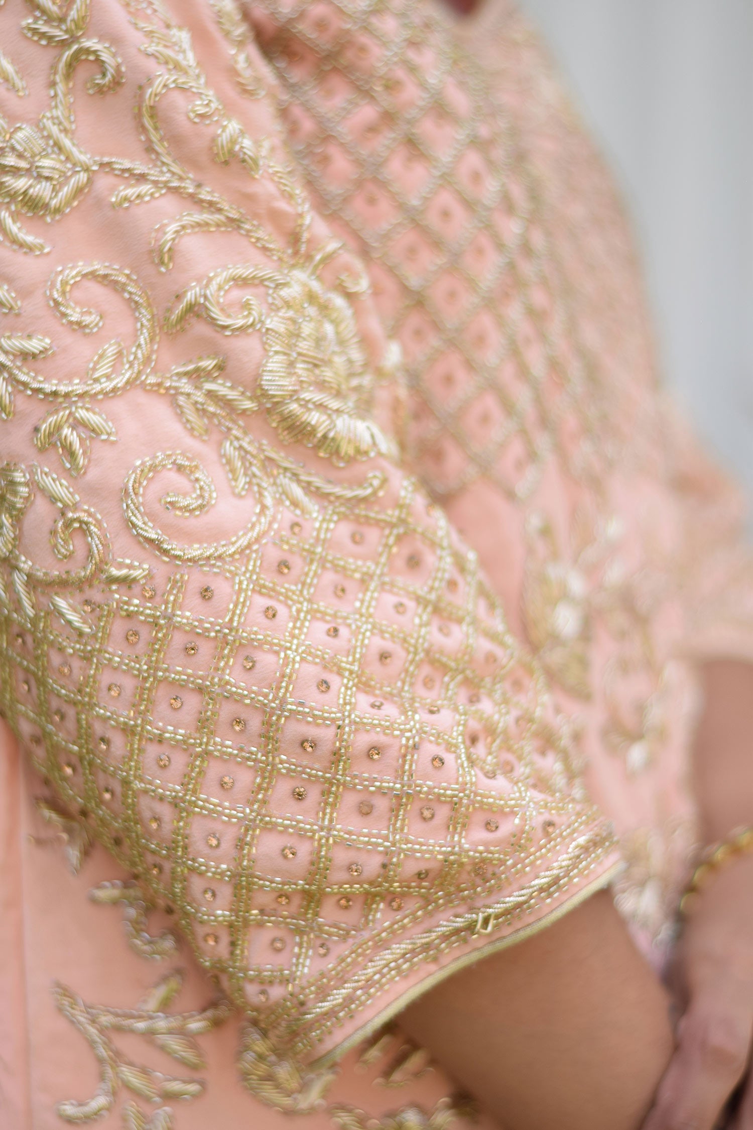 Sophisticated attire of Woman wearing Peach Crepe Silk Zardozi Jaal Work Gharara Set