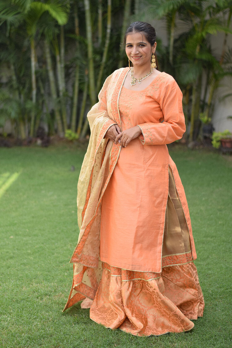 A beautiful Peach Kamkhab Farshi Gharara, Peach Chanderi Kurta & Golden Dupatta with Tissue Applique Work dress