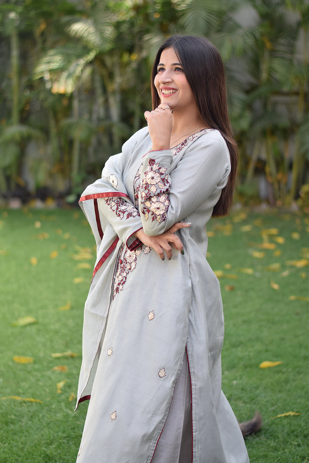 Indian women presenting gota patti work suit design