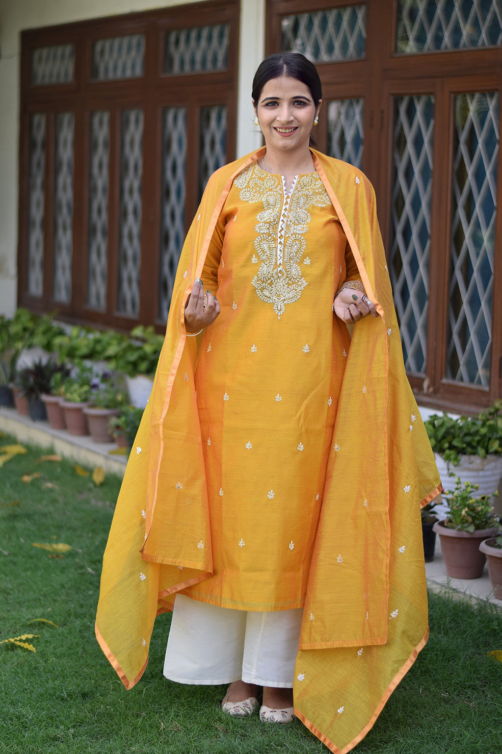 Indian women wearing yellow designer kurti palazzo set