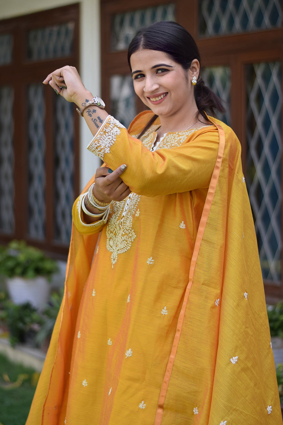 Indian women wearing yellow designer kurti palazzo set