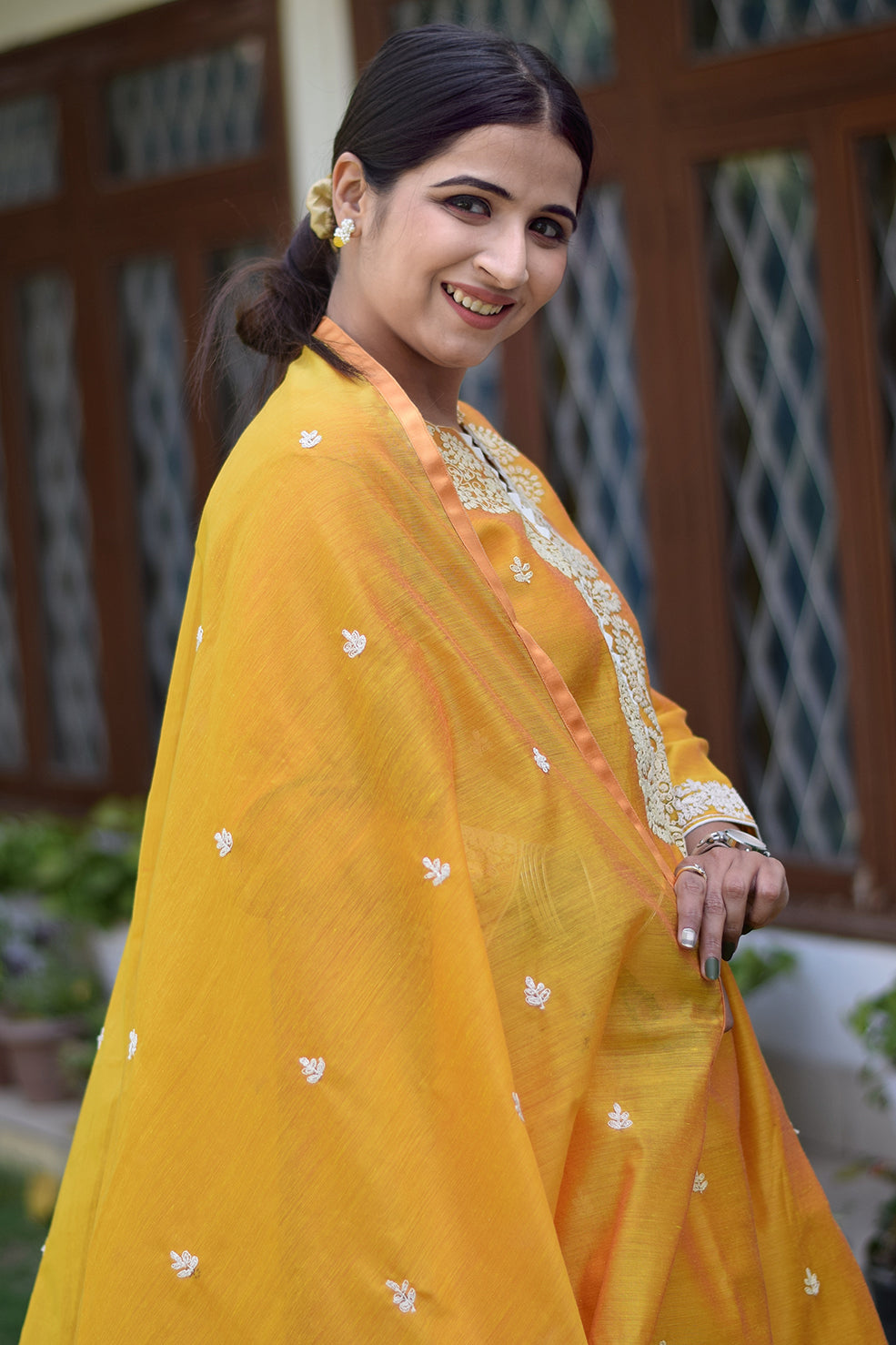 Indian women wearing yellow designer kurti palazzo set