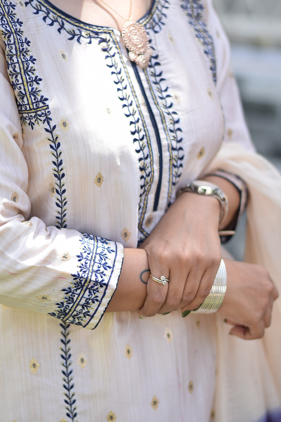 An Indian woman wearing an Off-White Silk Kurta 