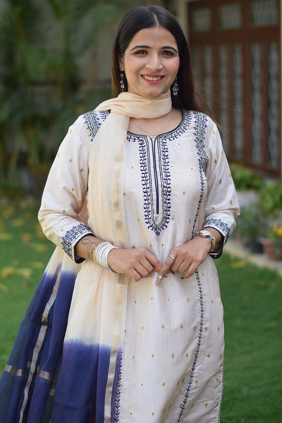 A portrait of an Indian woman wearing an Off-White Silk Kurta.
