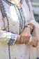 An Indian woman wearing an Off-White Silk Kurta 