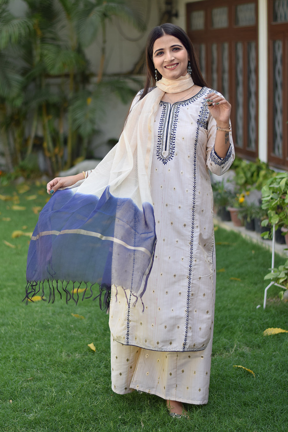 A close-up of an Indian woman's Off-White Silk Kurta.