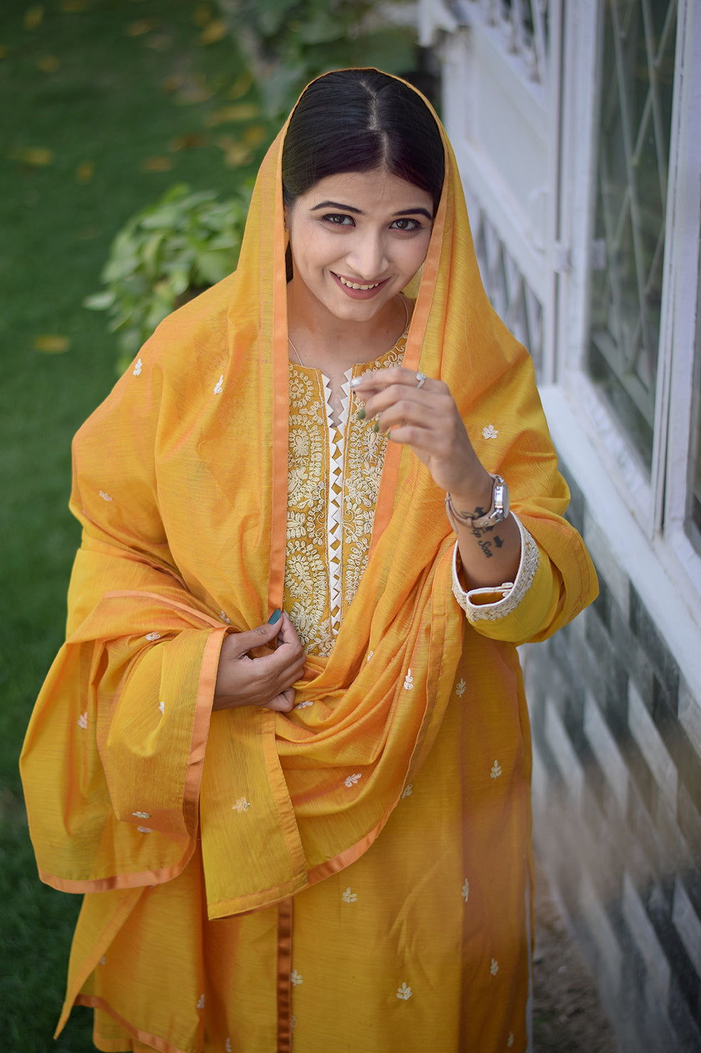 Indian women wearing yellow designer kurti palazzo set
