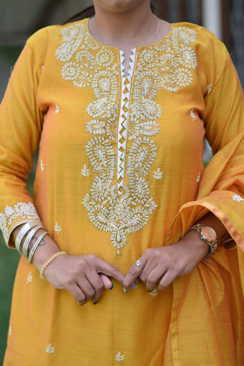 Indian women wearing yellow designer kurti palazzo set