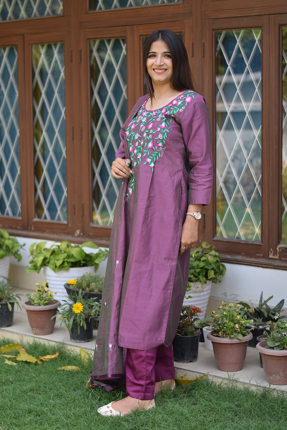 Indian women wearing purples embroidered kurta 