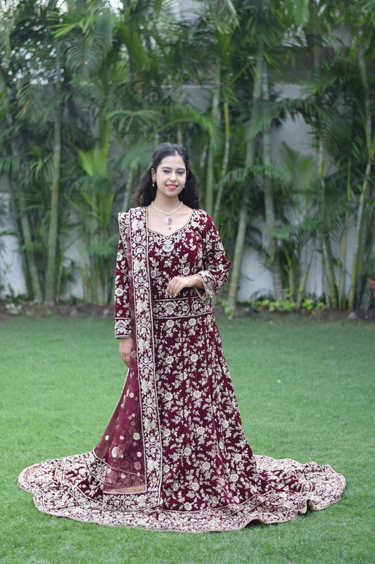 This Trail Gown in maroon is the perfect choice for any special occasion, as showcased by this Indian woman wearing it.