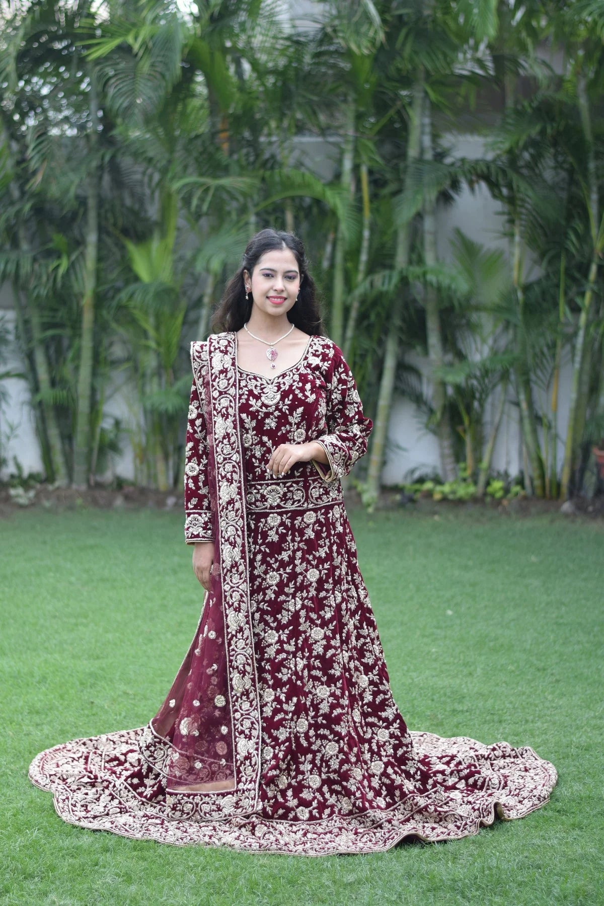 This Trail Gown in maroon is the perfect choice for any special occasion, as showcased by this Indian woman wearing it.