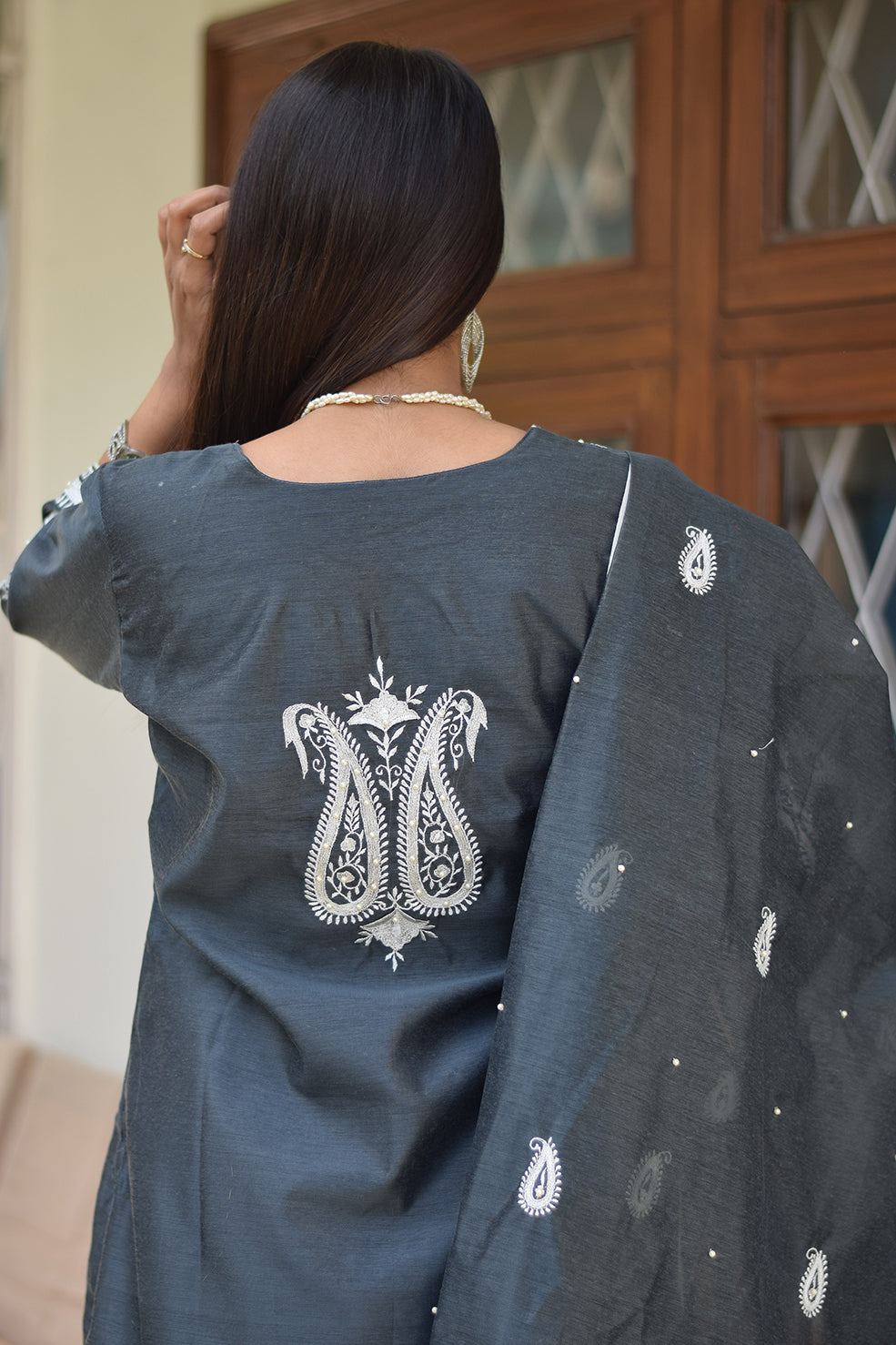 A traditional Indian grey kurta and dupatta set on a female model.