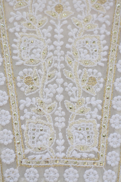 A close-up of a white georgette dupatta featuring intricate chikankari embroidery with delicate kikri and kamdani work.