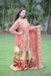 A fashionable lady in a beautifully crafted farshi gharara in golden rust.