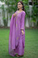 A woman's outfit featuring a beautifully embroidered purple lilac kurta and coordinating trousers.