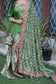 A magnificent Indian wedding gharara suit made of green silk and decorated with kamkhab zardozi embroidery.