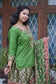 A stunning green bridal outfit with kamkhab zardozi embroidery on a silk gharara suit.