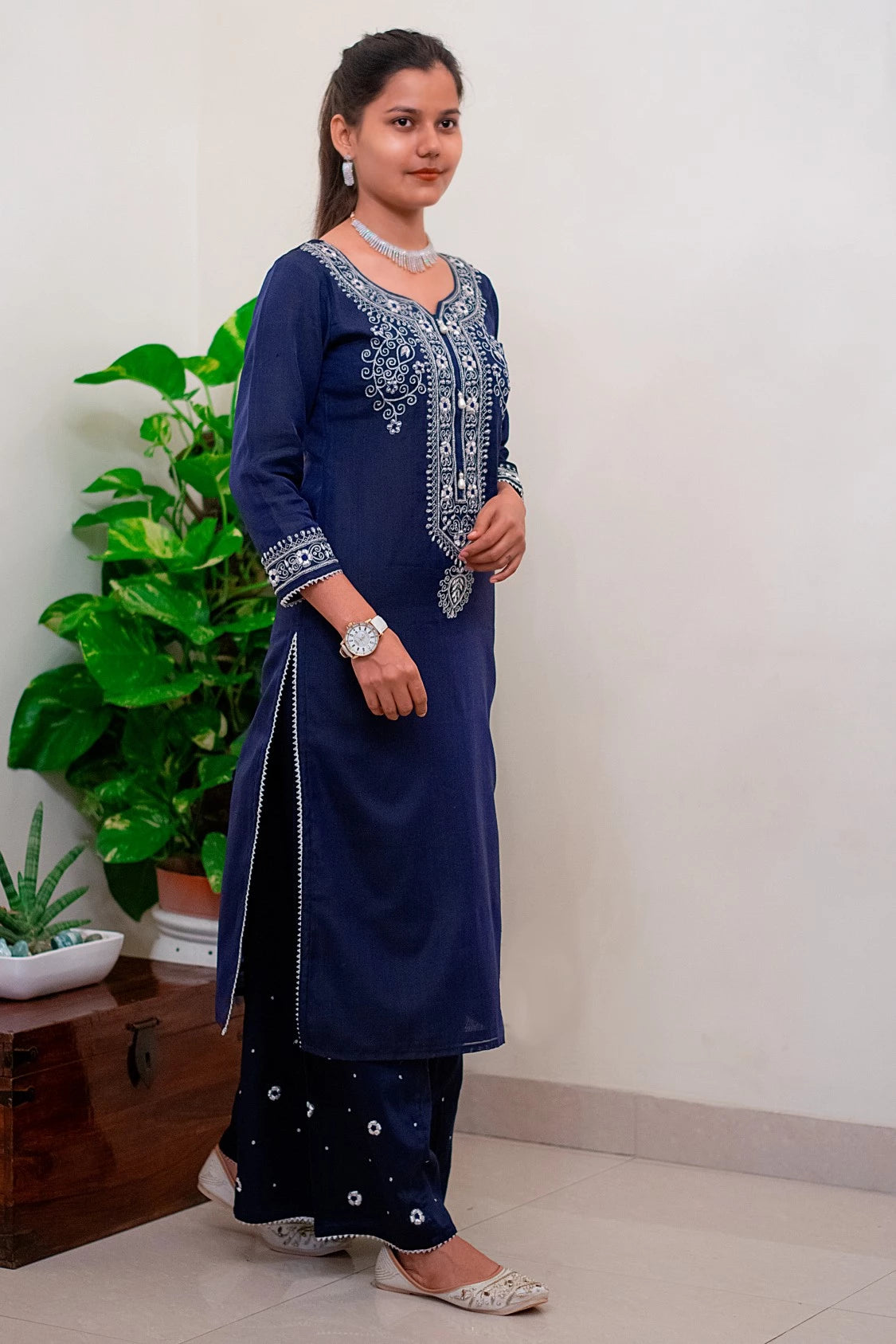 A group of friends enjoying a festive occasion, all wearing different shades of blue kurtas and dupattas, representing the diverse range of regional styles and preferences in Indian fashion.